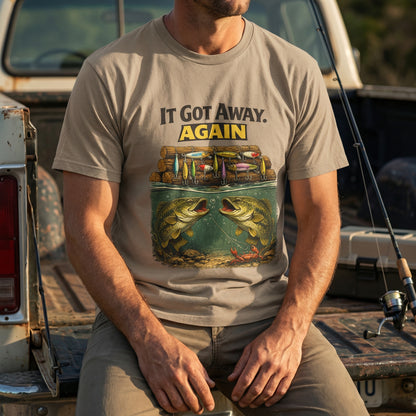 It Got Away Again’ fishing graphic t‑shirt in sand color on flat lay