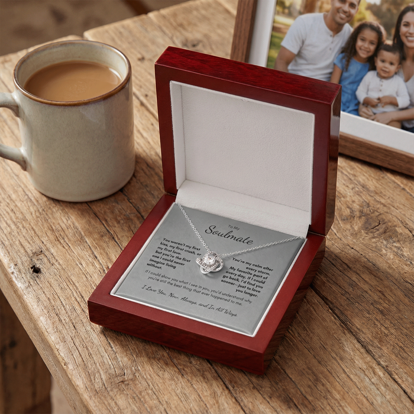 Always Love Knot necklace gift box placed on table with coffee mug