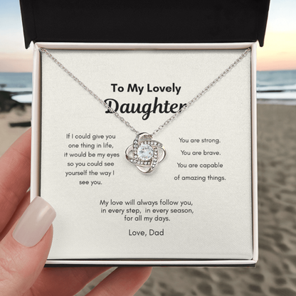 Love Knot Necklace with a message card for a daughter from dad on a beach.