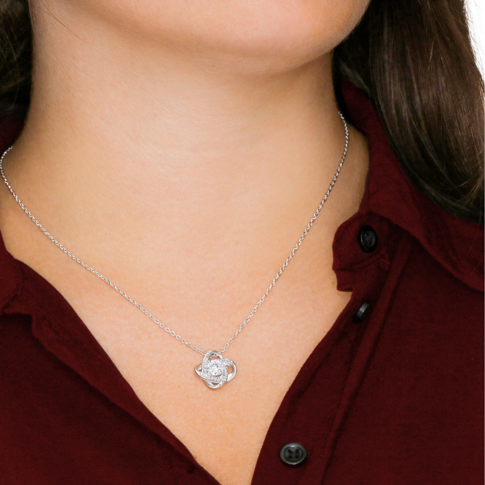 Love knot necklace worn by woman representing father daughter bond jewelry