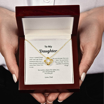 To My Daughter Love Knot necklace gift from Dad held with both hands showing heartfelt keepsake card