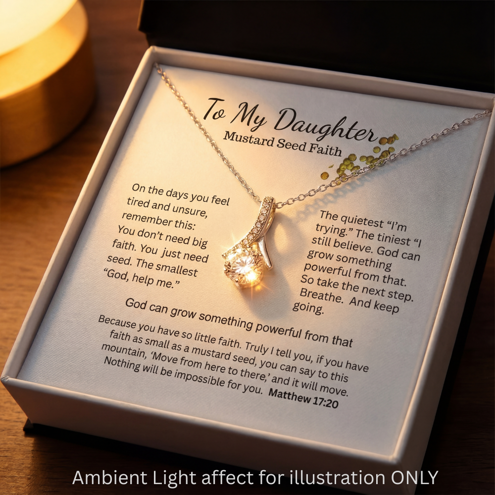 Close-up of the Mustard Seed Faith message card with necklace pendant displayed in the box