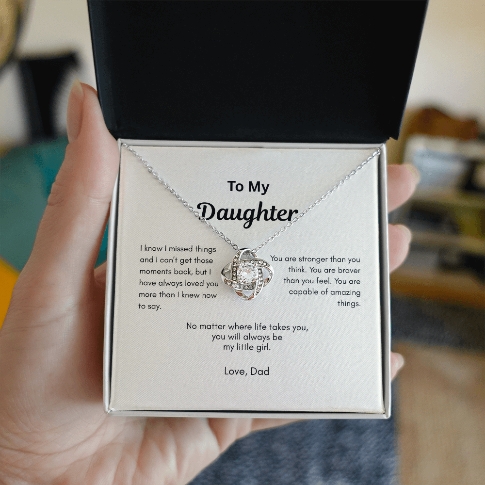 Love Knot necklace gift for daughter from Dad held in hand with message card inside gift box