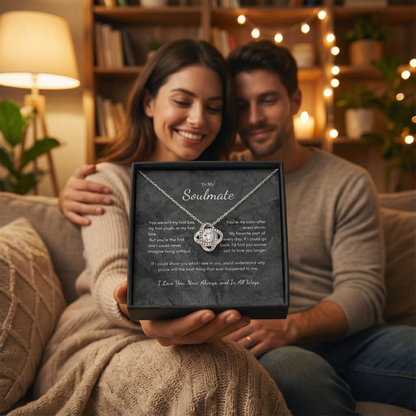 Romantic couple holding To My Soulmate Love Knot necklace gift box